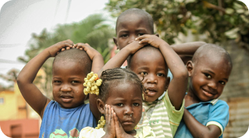 Children putting their hands on their heads