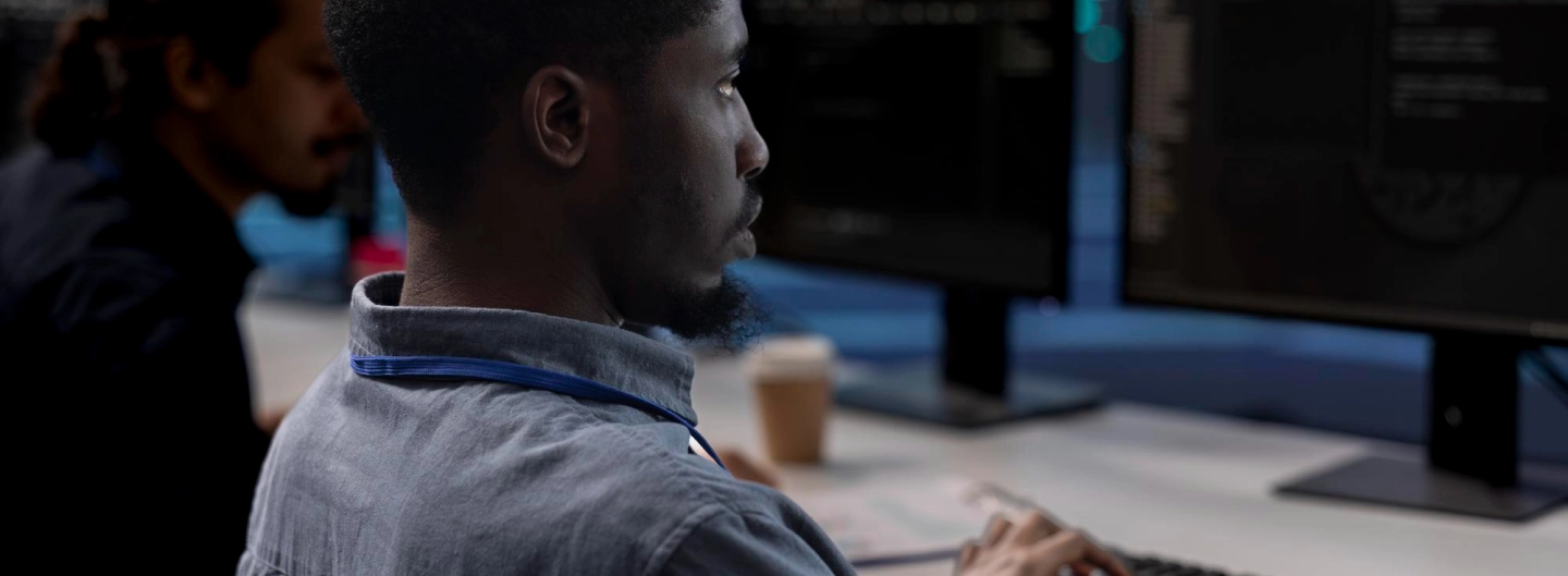 A man in front of a computer